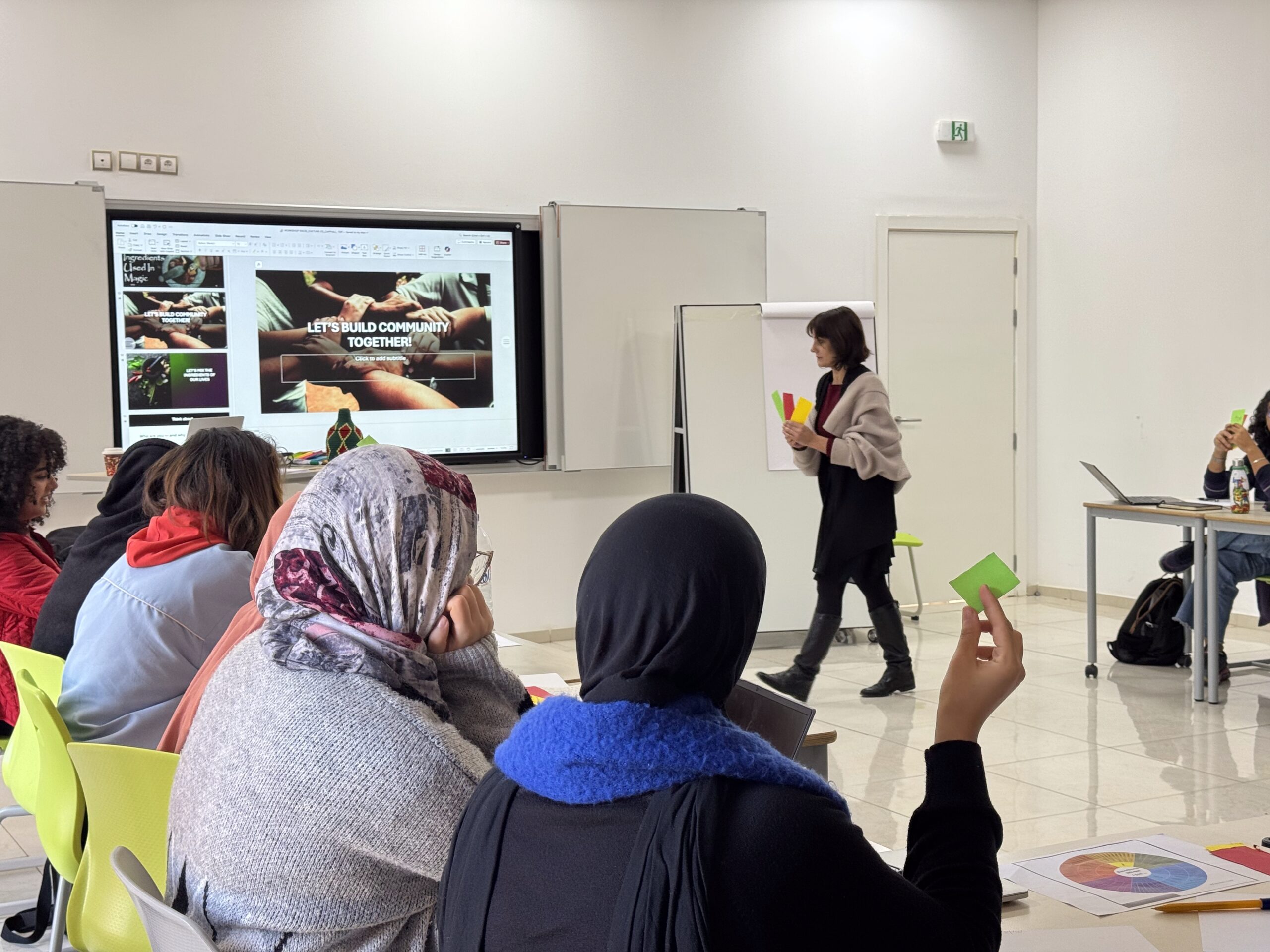 Students participating in a TEP workshop in Morocco, listening to a facilitator during an interactive classroom activity.